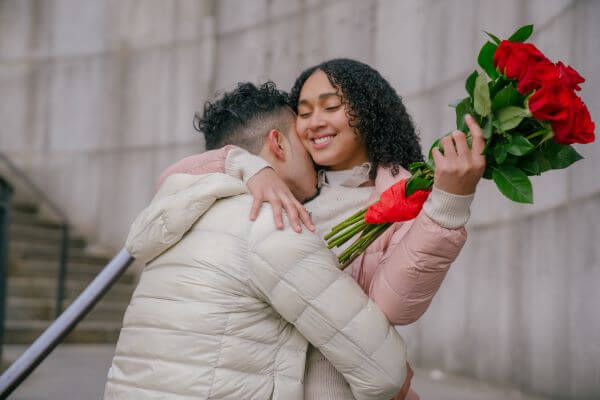 Teen receiving a present from a boyfriend on 18th birthday